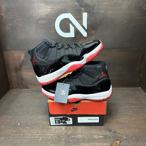 Jordan 11 Retro Playoffs Bred (2019) Size 10 (Pre-Owned) - front