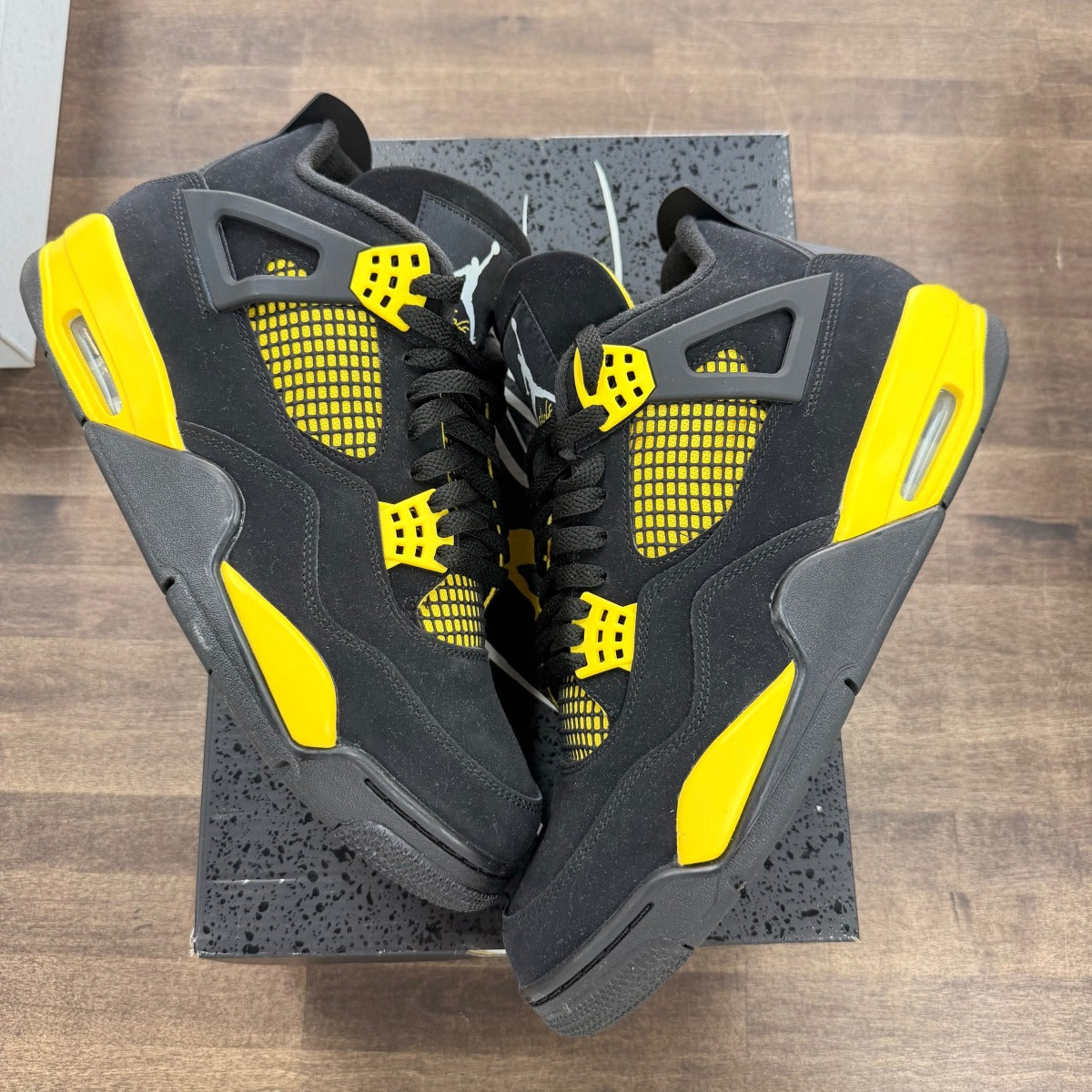 Jordan 4 Retro Thunder (2023) - Image 1