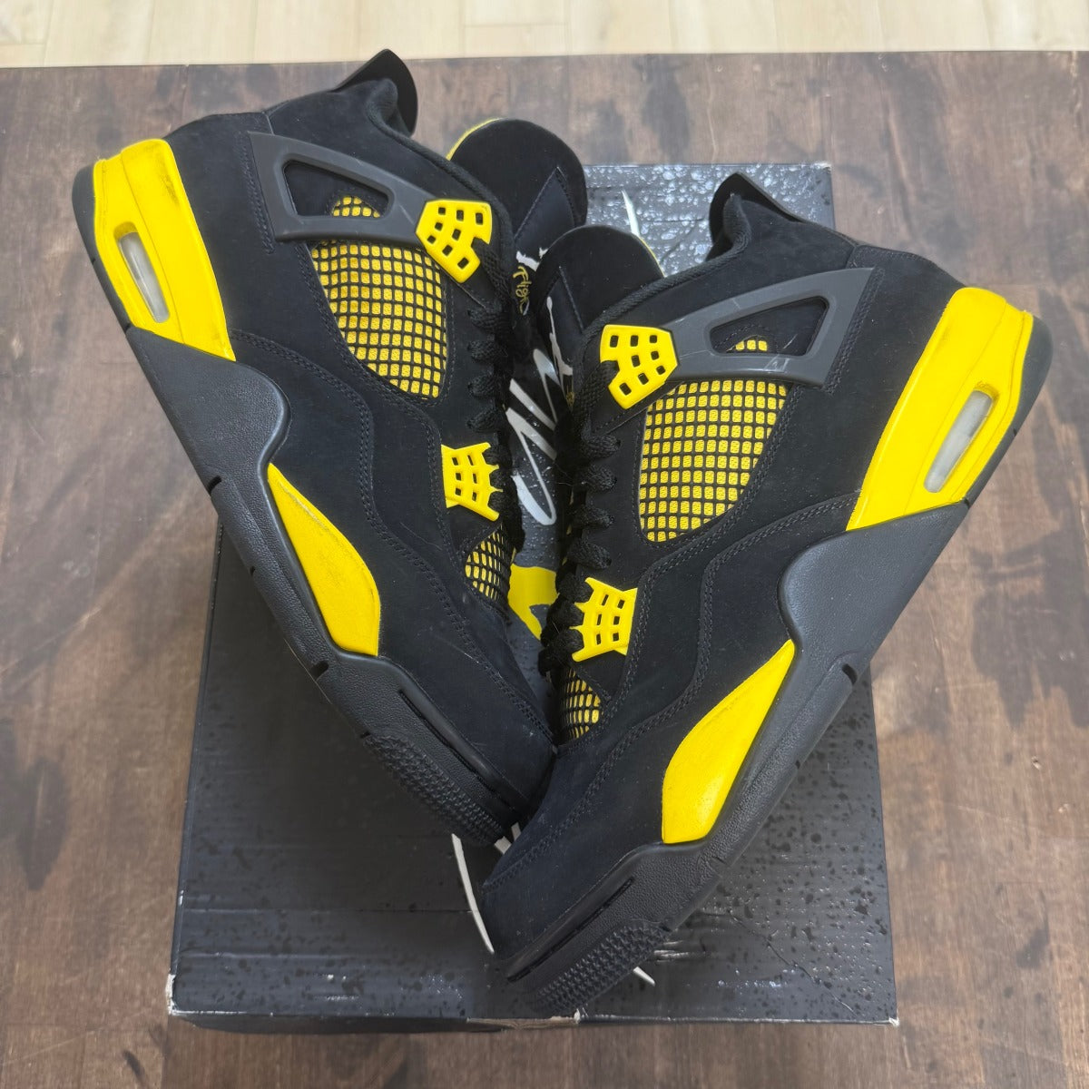 Jordan 4 Retro Thunder (2023) - Image 1