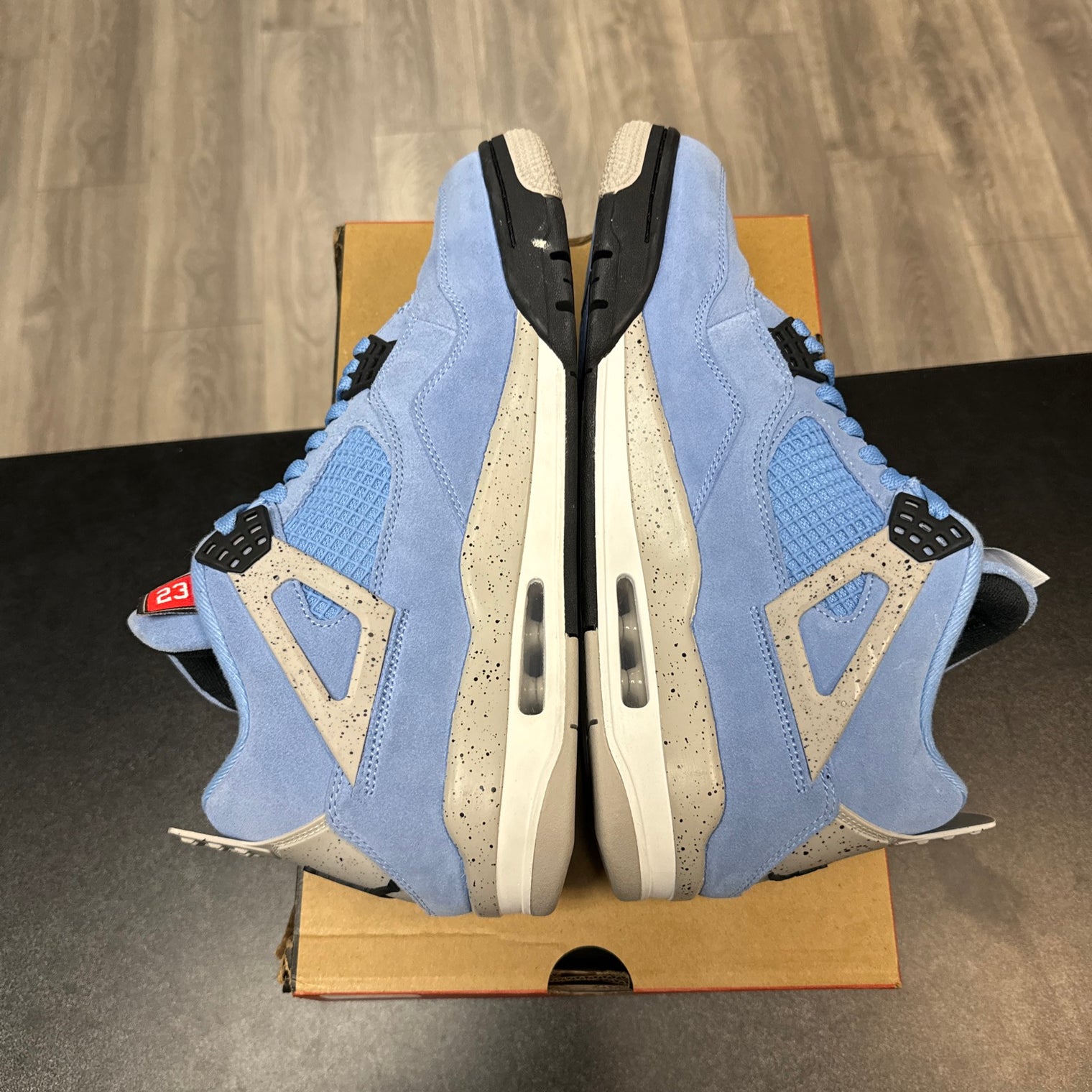 University Blue Jordan 4 Retro (USED, replacement box)