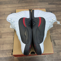 Taxi Flip Jordan 12 Retro (USED)