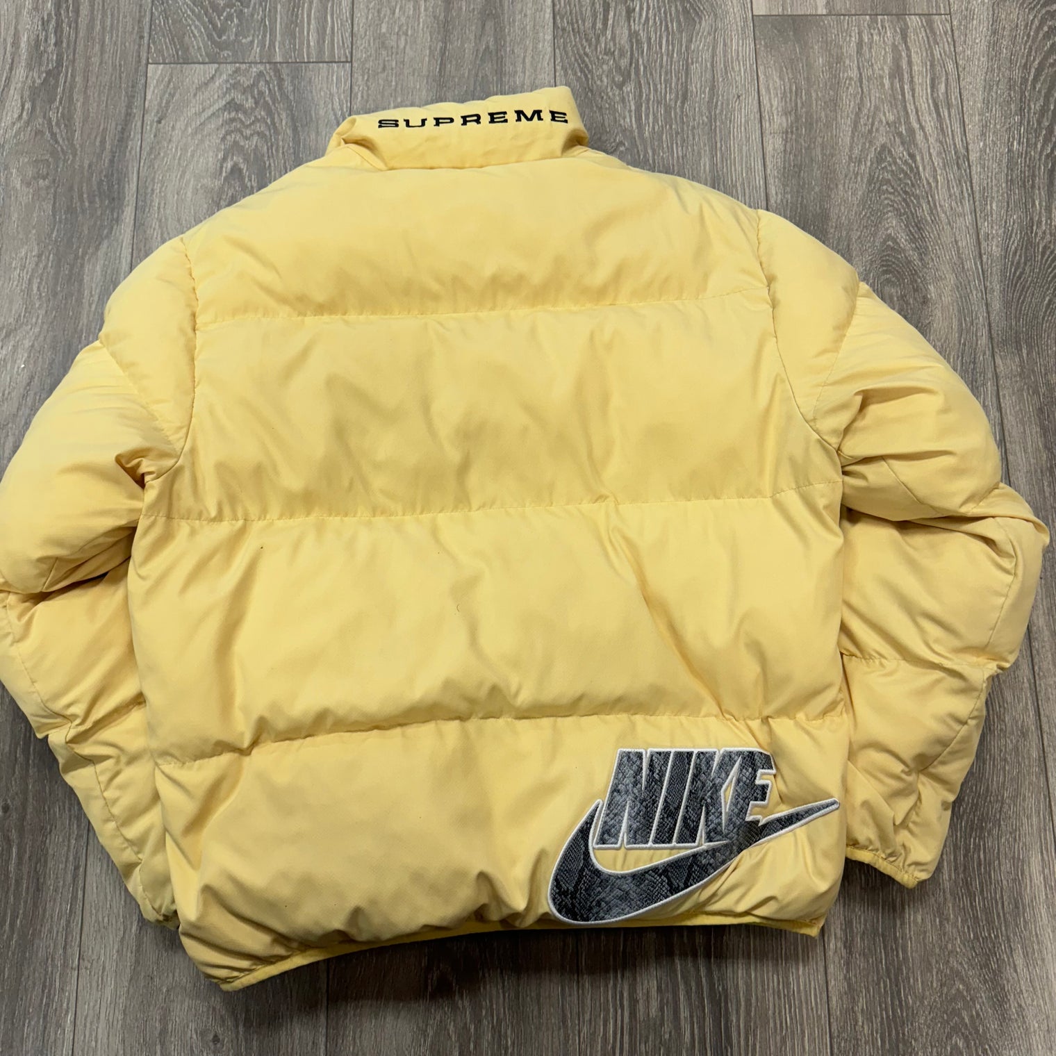 Supreme Nike Pale Yellow Puffer Jacket (USED)