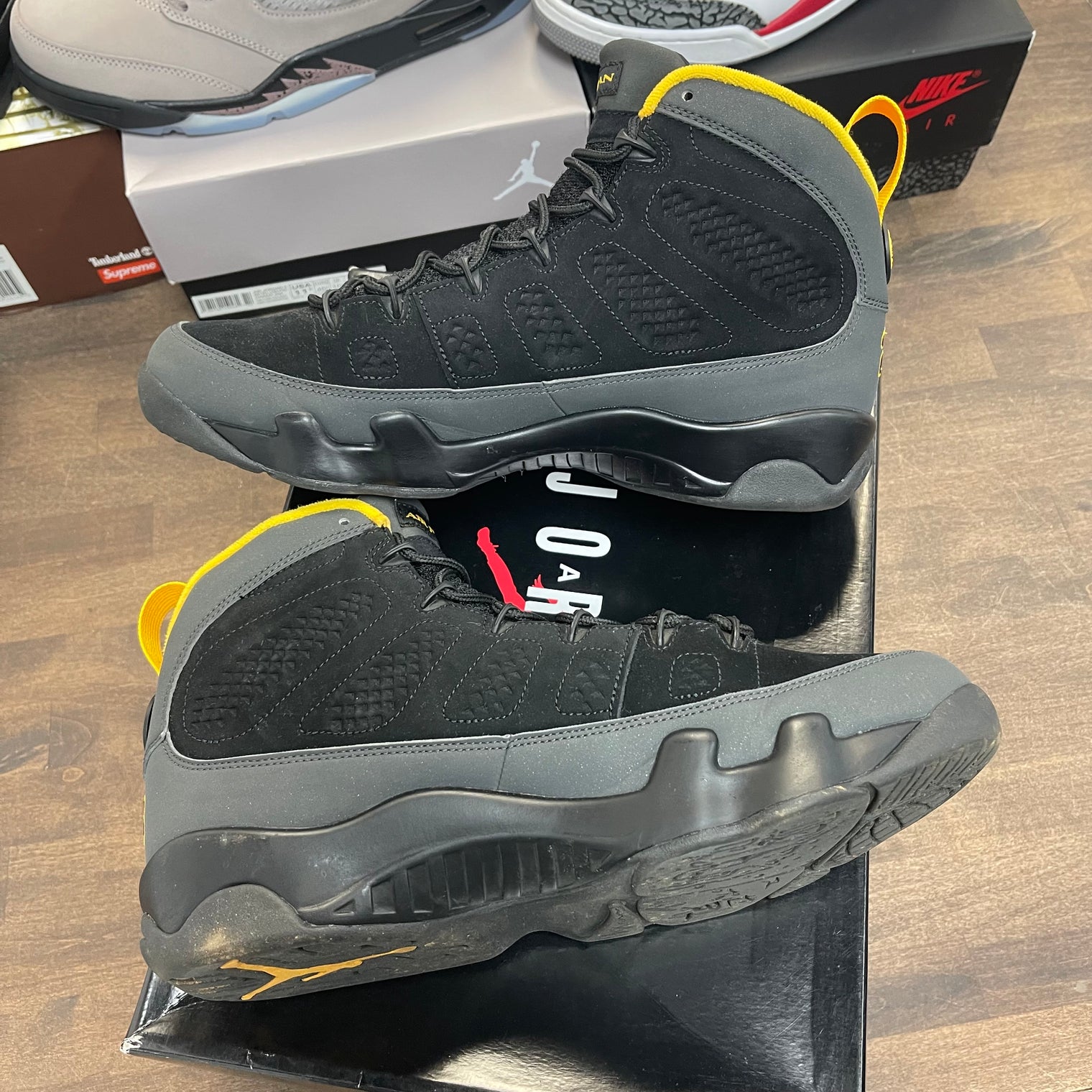 University Gold Dark Charcoal Jordan 9 Retro (USED)