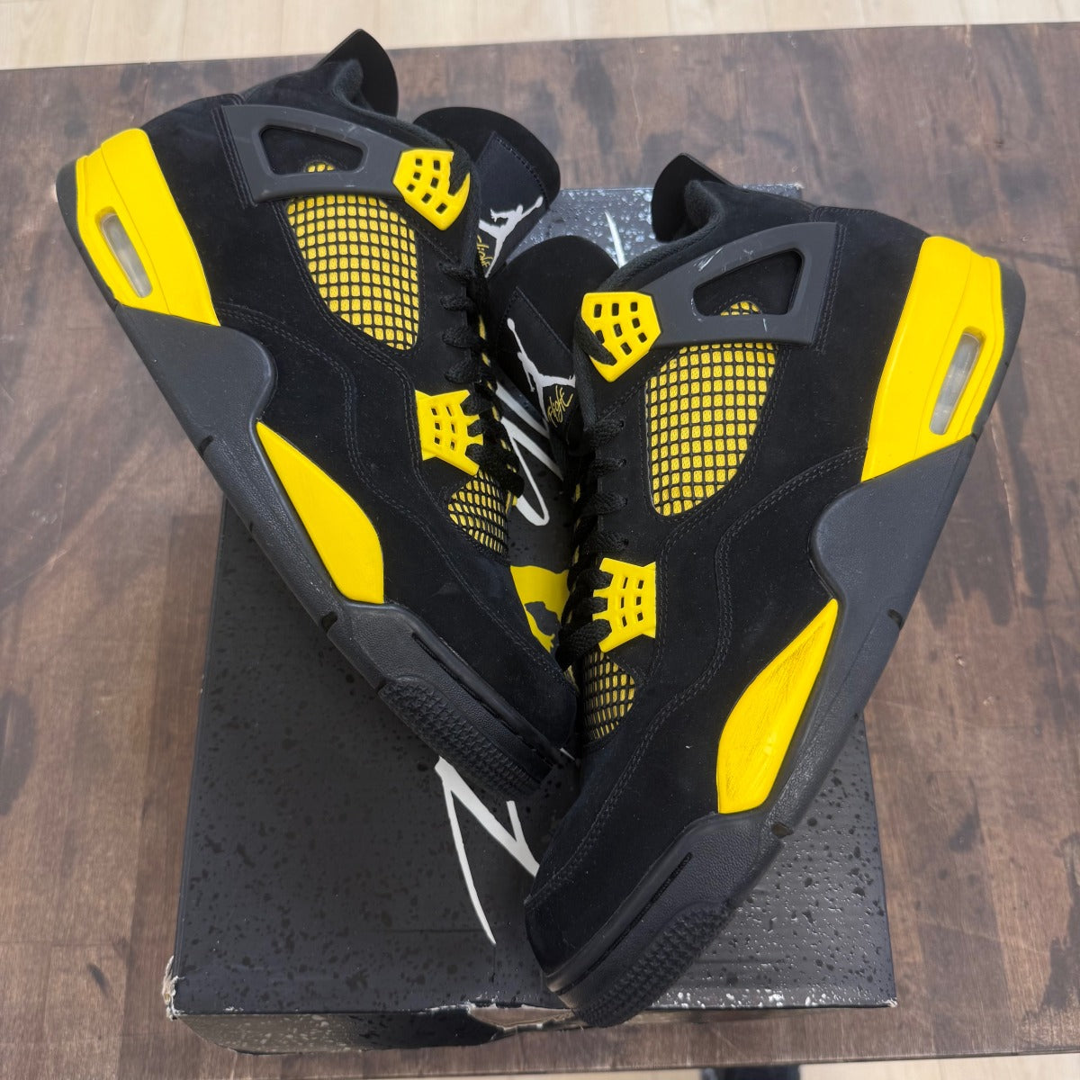 Jordan 4 Retro Thunder (2023) - Image 1
