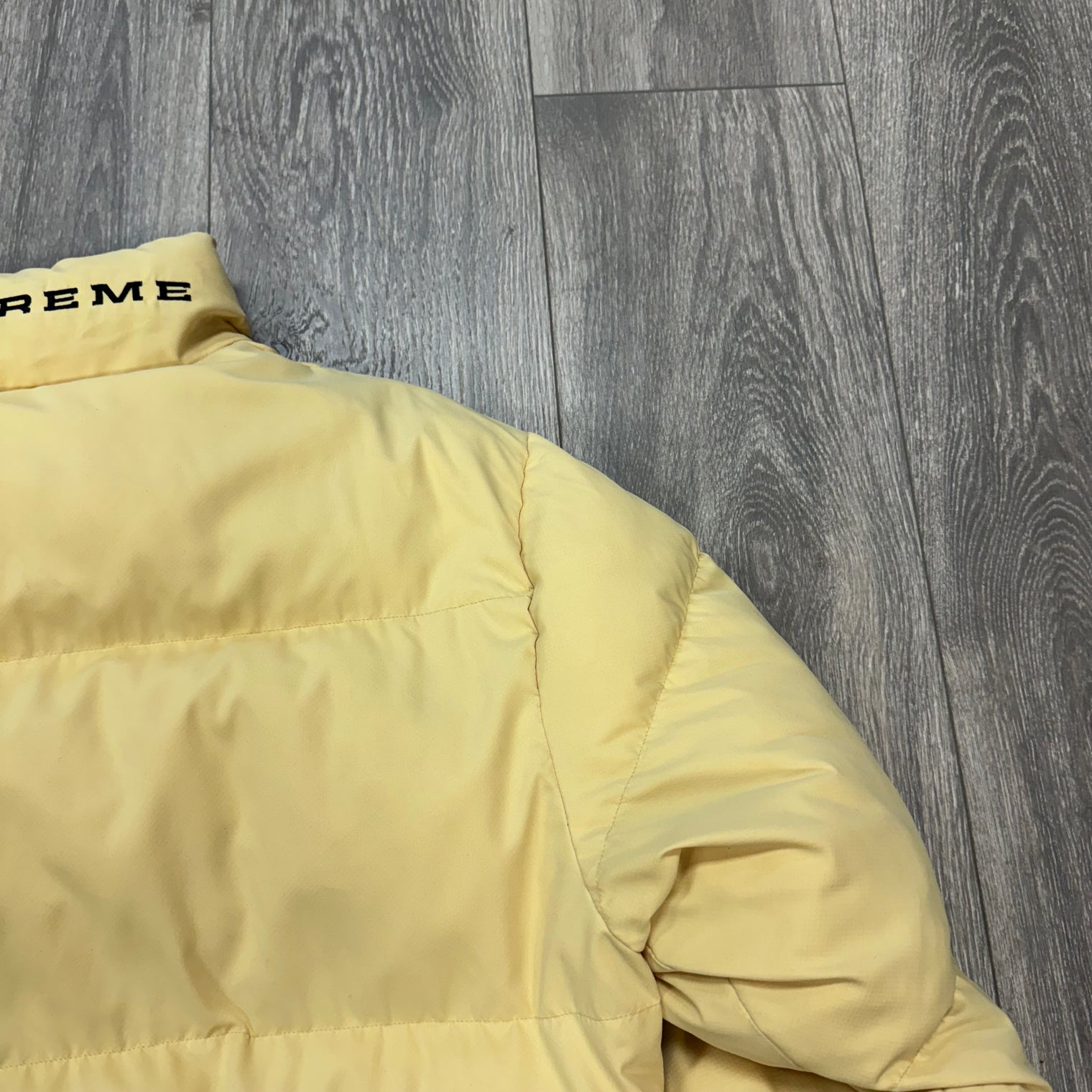 Supreme Nike Pale Yellow Puffer Jacket (USED)