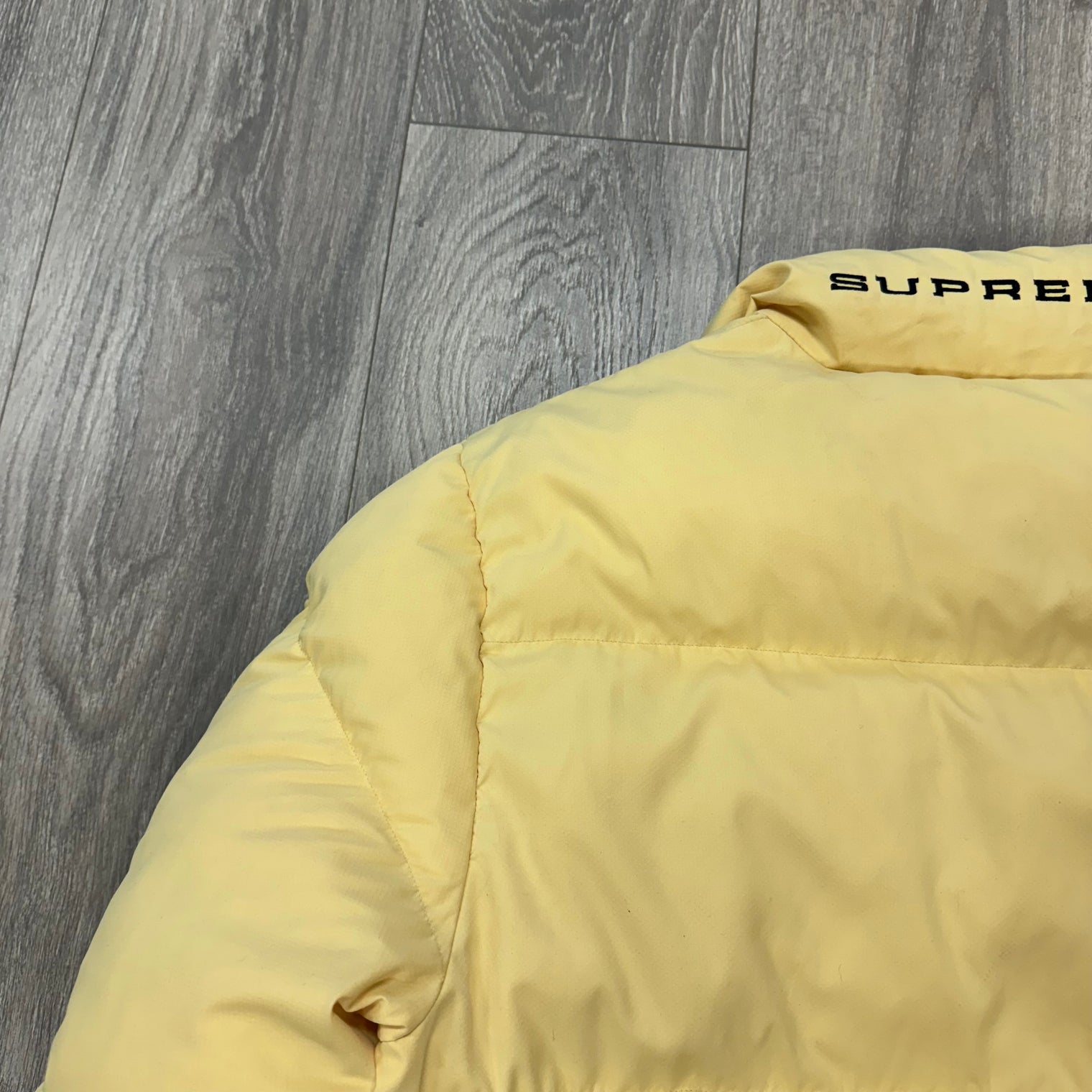 Supreme Nike Pale Yellow Puffer Jacket (USED)