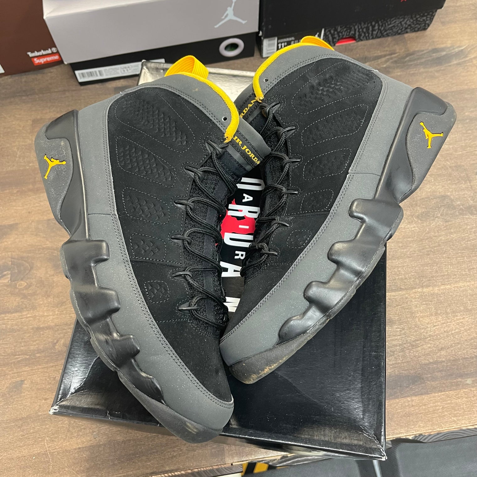 University Gold Dark Charcoal Jordan 9 Retro (USED)
