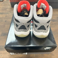 Black Cement Jordan 11 Low IE (USED)