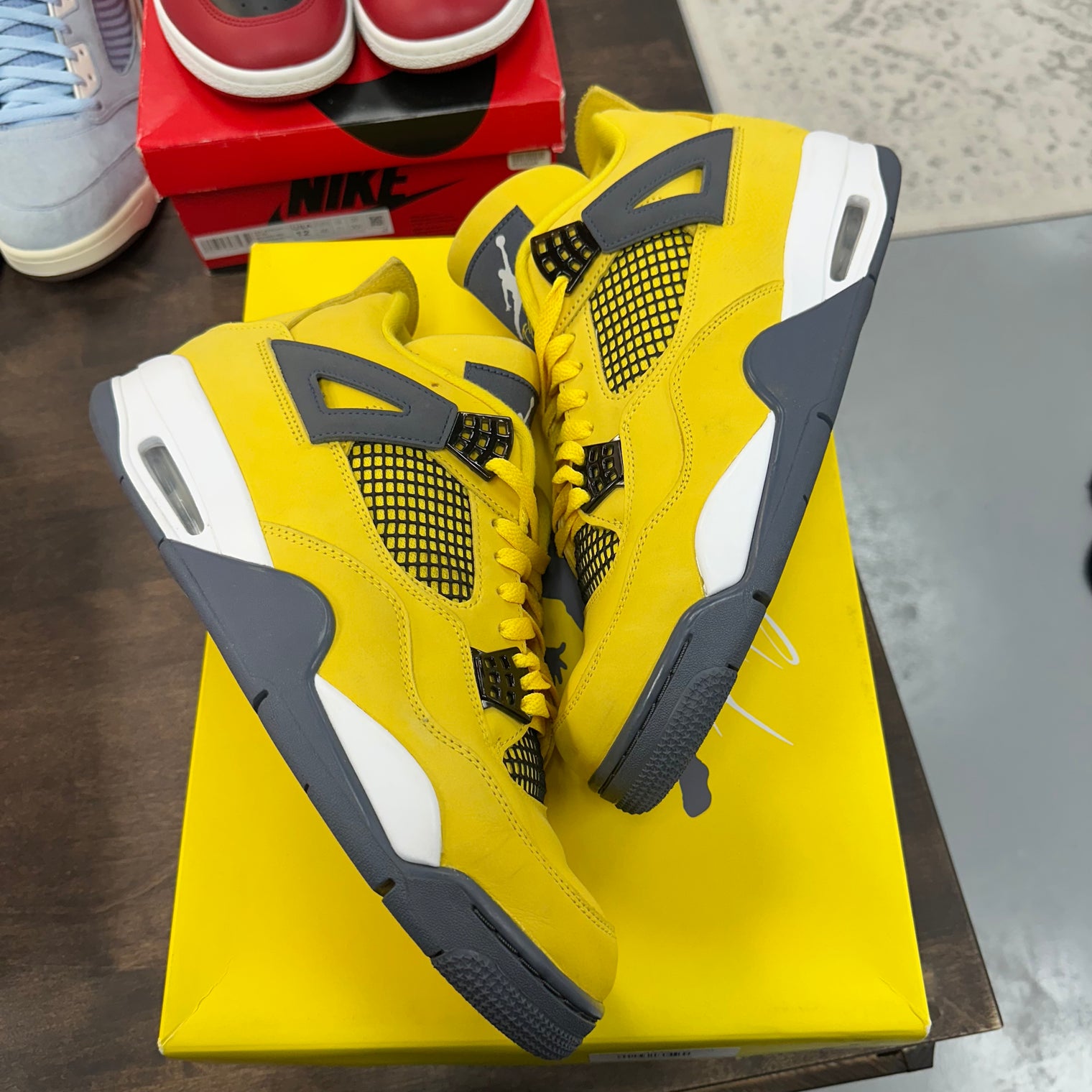 Lightning Jordan 4  (USED)