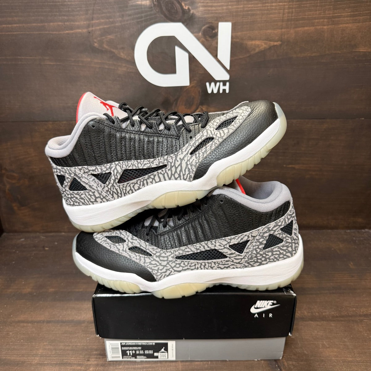 Jordan 11 Retro Low IE Black Cement - Image 1